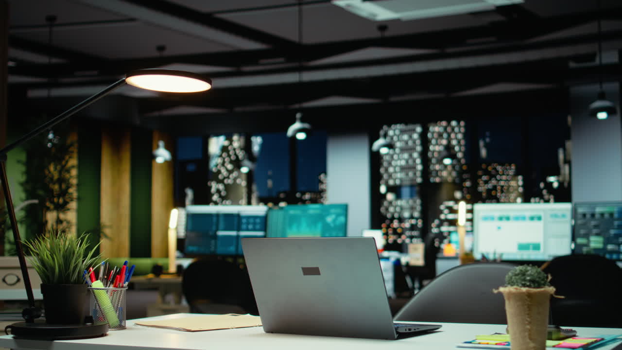 Vertical Video High end empty office features laptop and monitors for forecasting