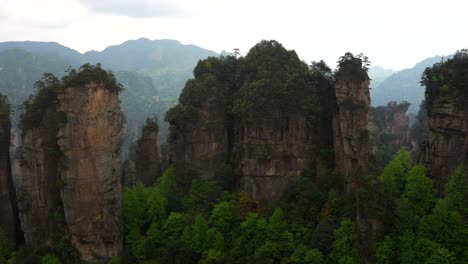 panning right shot of five fingers peak and other rock formations in huangshi village, zhangjiajie, china