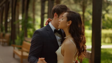 charming man and woman having first dance outdoors. sweet couple dancing in park