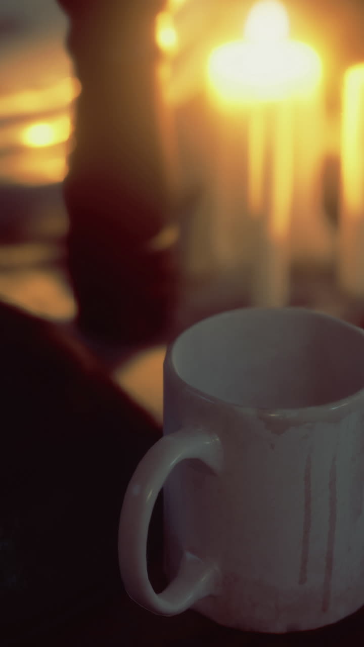 Warm glow of candlelight illuminating a quiet evening table setting