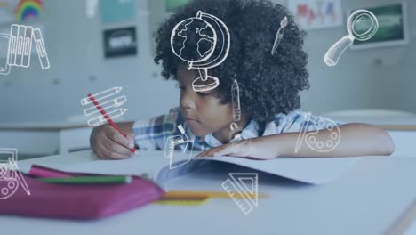 Animation-of-school-icons-over-happy-biracial-schoolboy-writing-at-desk-in-class