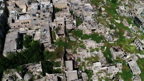 the ancient city in the middle of aleppo in syria. we still can see buildings destroyed even 10 years after the war - aerial view 4k