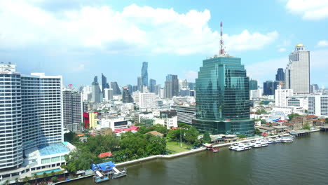 bangkok cityscape with skyscrapers and cat tower as seen from and chao phraya river