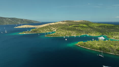 luxury yachts anchored in the clear bays at hvar island