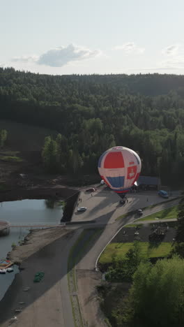 hot air balloon festival in a forest