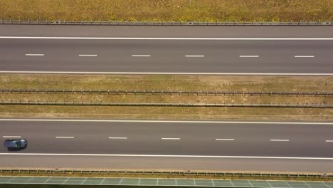 Traffic-of-cars-and-trucks-on-the-Freeway-in-Summer-day---top-view-shot