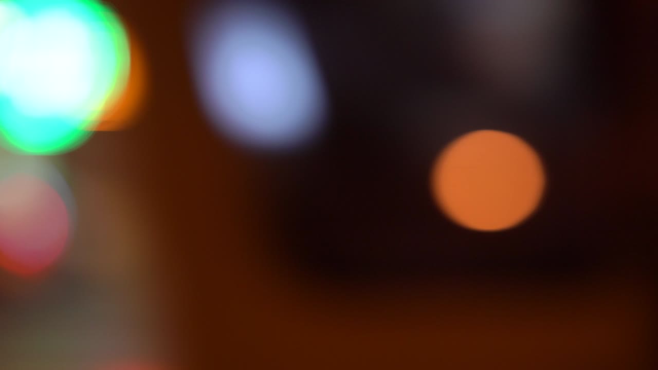 Defocused and blur night city street traffic lights bokeh background.