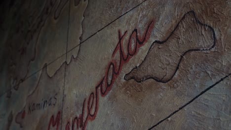 view of an ancient map on a wall, close up shot