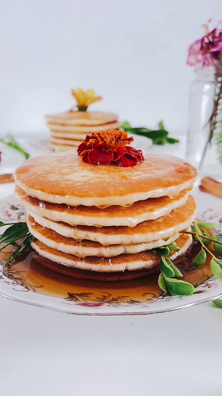 Stack of Delicious Honey-Drizzled Pancakes with Flowers
