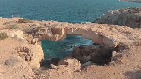 stone arch at the coast - aerial view