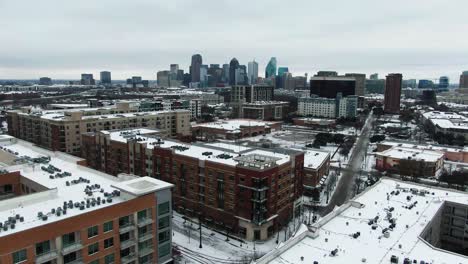 Establishing-drone-shot-of-city-skyline-covered-in-snow