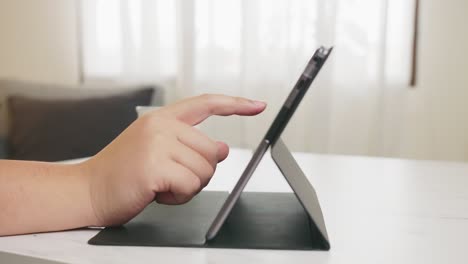 Man-using-digital-tablet-in-home-office