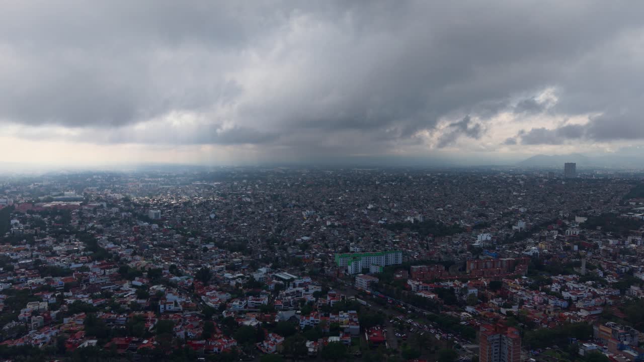 Southern Mexico City from above, capturing rainy clouds in eastern area