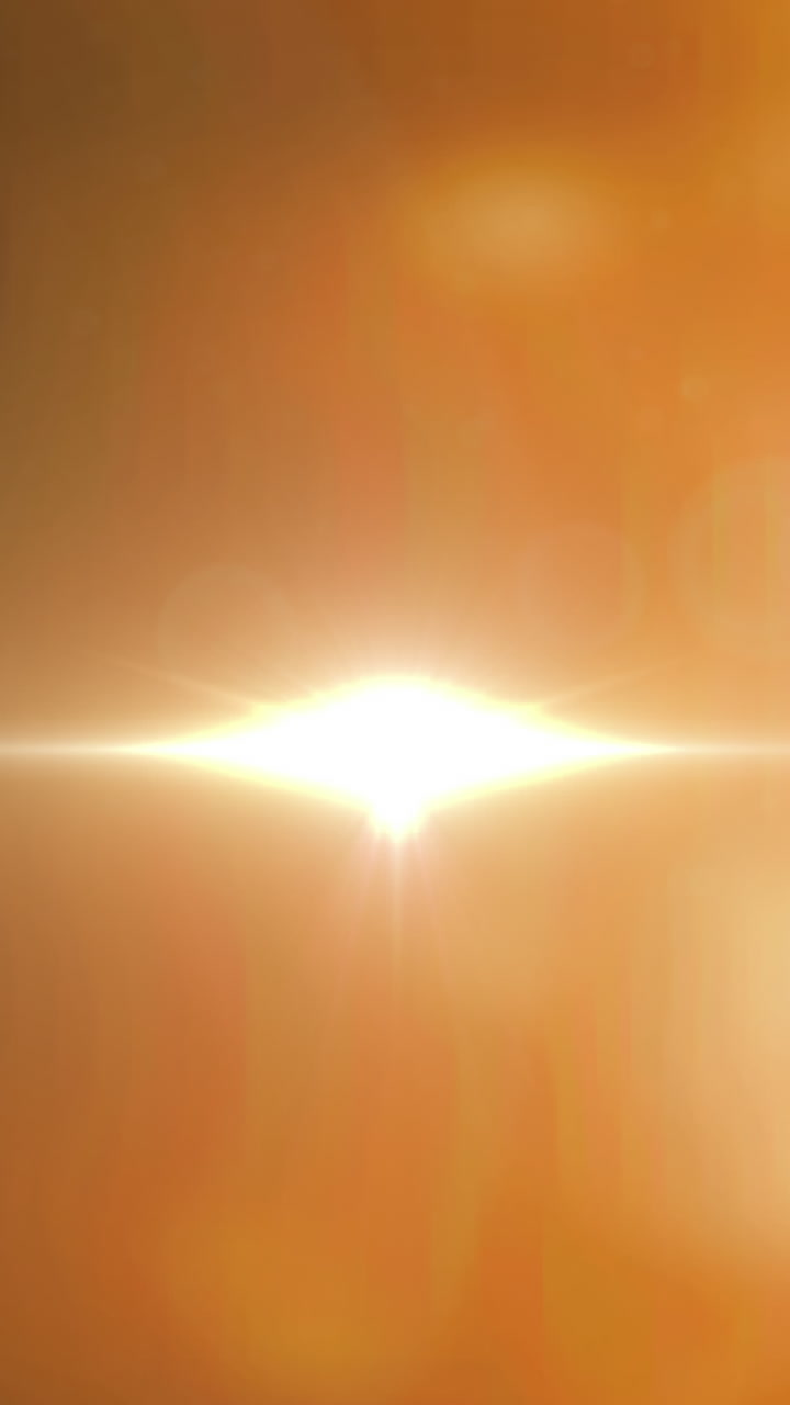 오렌지색 배경에 빛나는 반점의 애니메이션