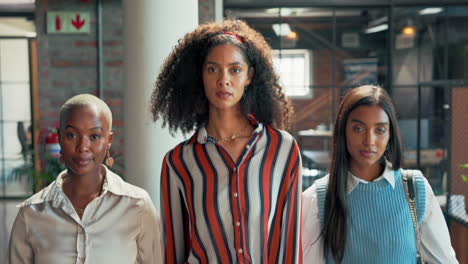 three confident businesswomen standing together