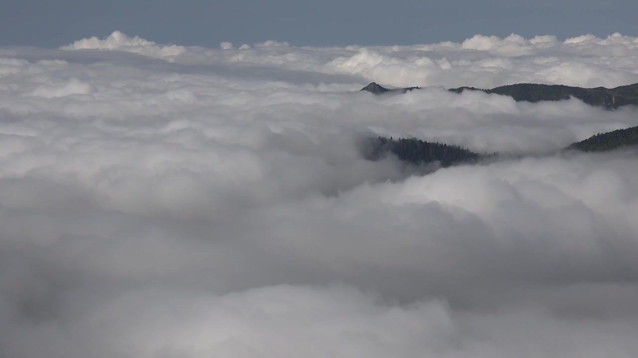 Time Lapse of Dense Clouds Moving Over Mountain Peaks