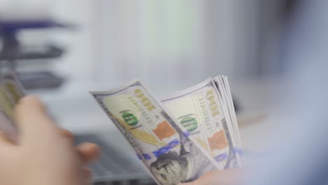 Close-up-male-hands-counting-money.