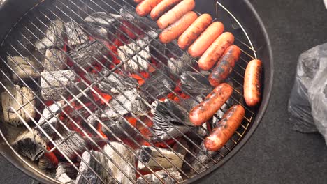 grilled sausages on charcoal grill