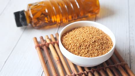 coking oil and seeds in a container on table