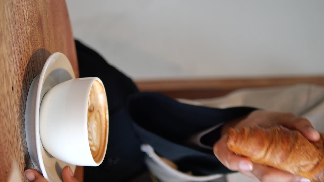 Enjoying Coffee and Croissant