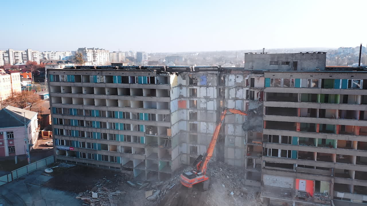 Dismantling of a house. Destroying Old House With Bulldozer Mechanical Arm