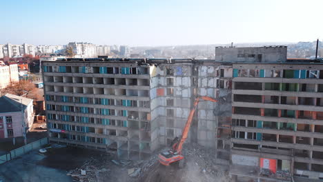 dismantling of a house. destroying old house with bulldozer mechanical arm