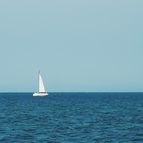 sea with a sailboat on the horizon. sea horizon.