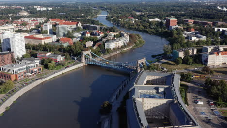 aerial shot over river oder and the grunwald bridge in wroclaw, poland