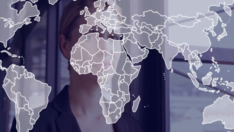 in office, businessperson looking out window with world map animation overlay