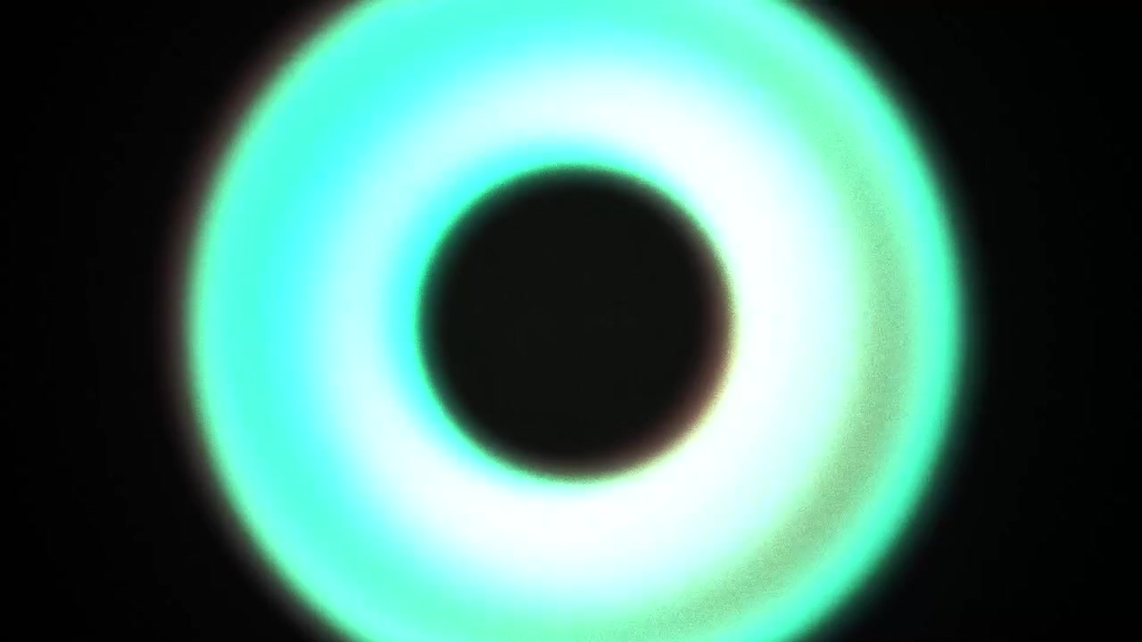 Pulsating Neon Green Circle with Digital Glitch Effect on Black Background