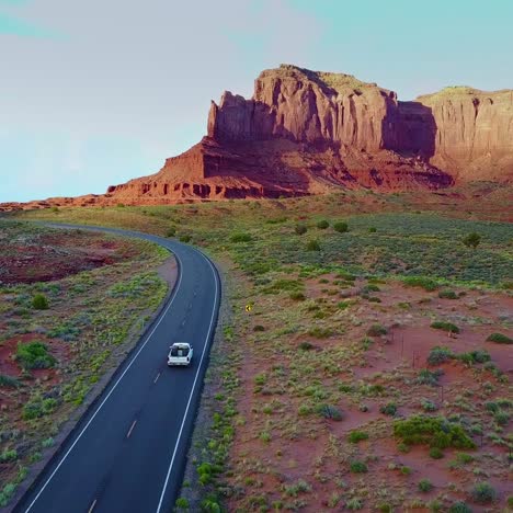 An-vista-aérea-over-a-truck-traveling-on-a-road-through-Navajo-country-in-Arizona