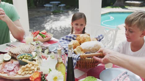 happy family eating together at table