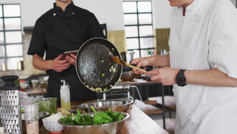 caucasian female chef teaching diverse group