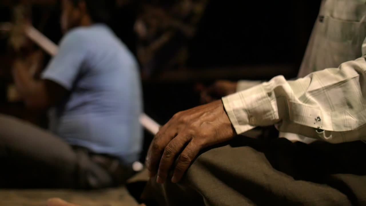 Man Tapping Regular Rhythm on Knees