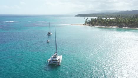 Luxurious-boats-anchored-at-Playa-Punta-Popy,-Las-Terrenas-in-Dominican-Republic