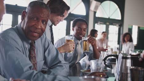 Group-Of-Businessmen-Meeting-For-After-Works-Drinks-In-Bar