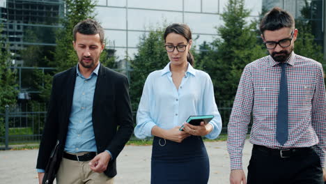 business people walking and talking