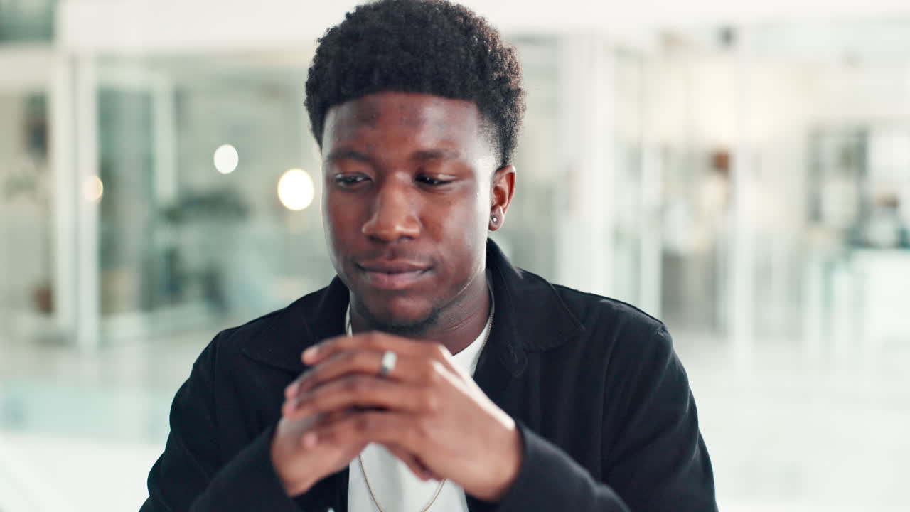 Portrait of a Contemplative Black Man in an Office Setting