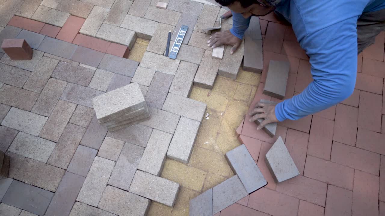 Bricklaying and Paving with Herringbone Pattern