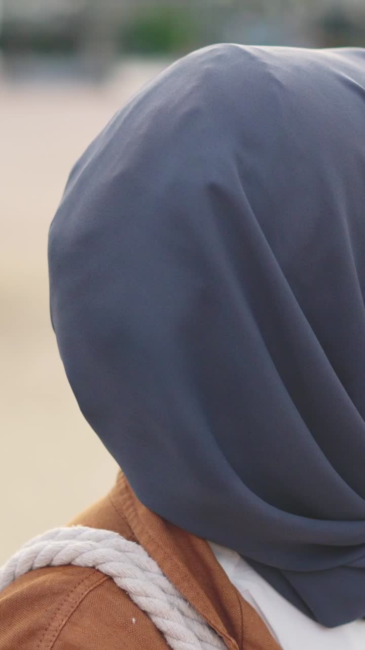 Close-up Portrait of a Smiling Woman in Hijab