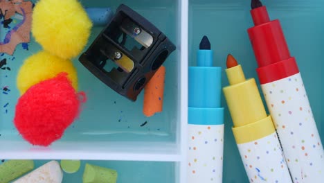 colorful art supplies in a storage box