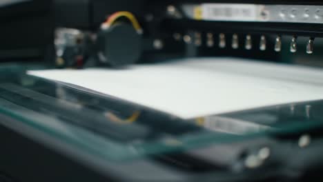 capturing the precision of a printer in action: an insightful look at the mechanisms that drive modern printing technology on paper surfaces