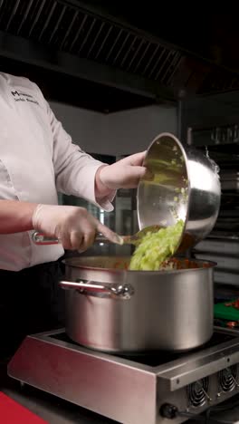 chef preparing a vegetable soup