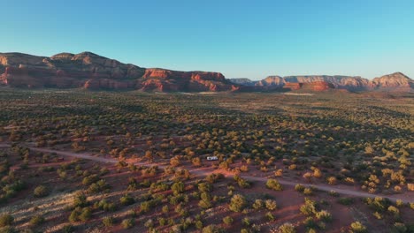 flying over green bushes on the desert of sedona in arizona, usa - drone shot