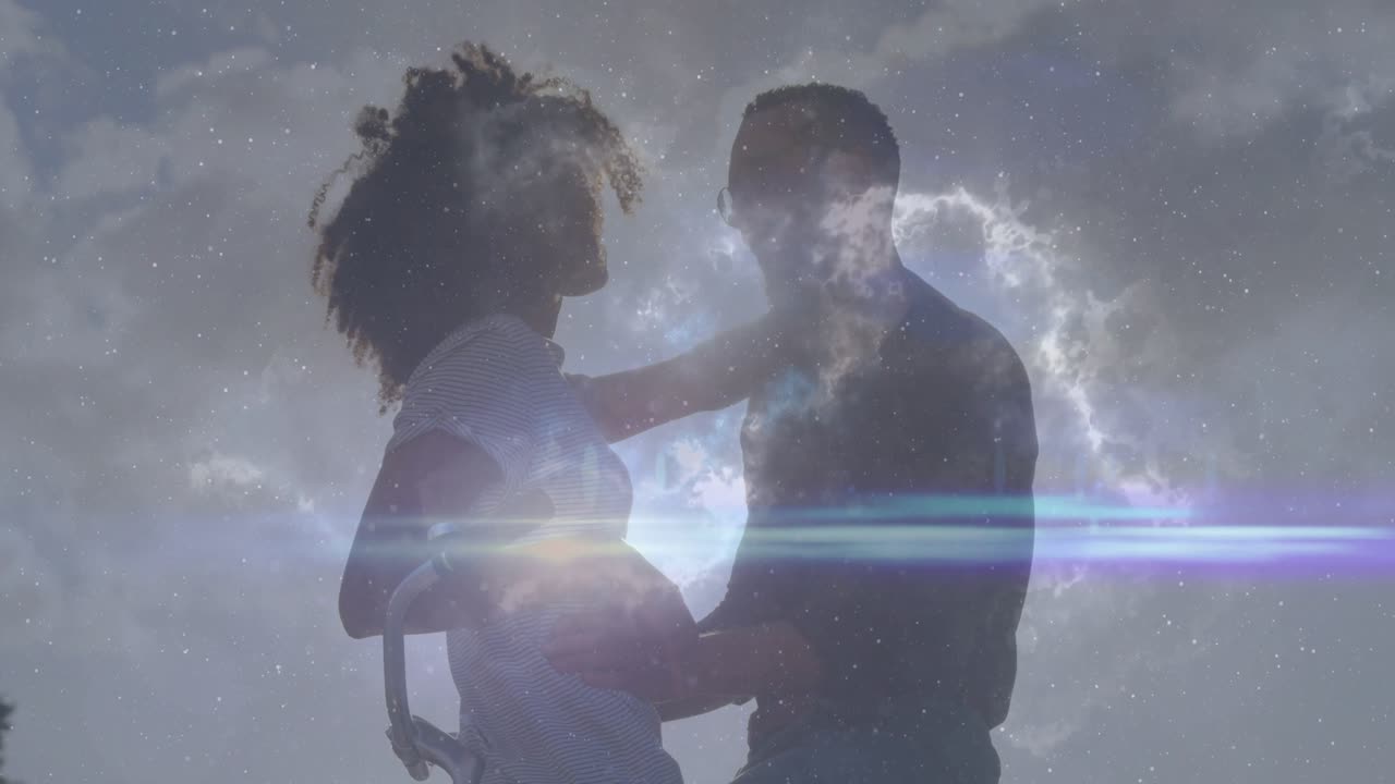 film couple placing hand on man's chest initiating cosmic overlay and guiding embrace under sky