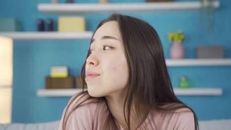 close-up portrait of tired and sleepy asian young woman.