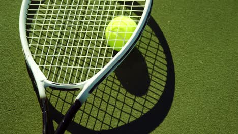 Close-up-of-tennis-racket-and-ball