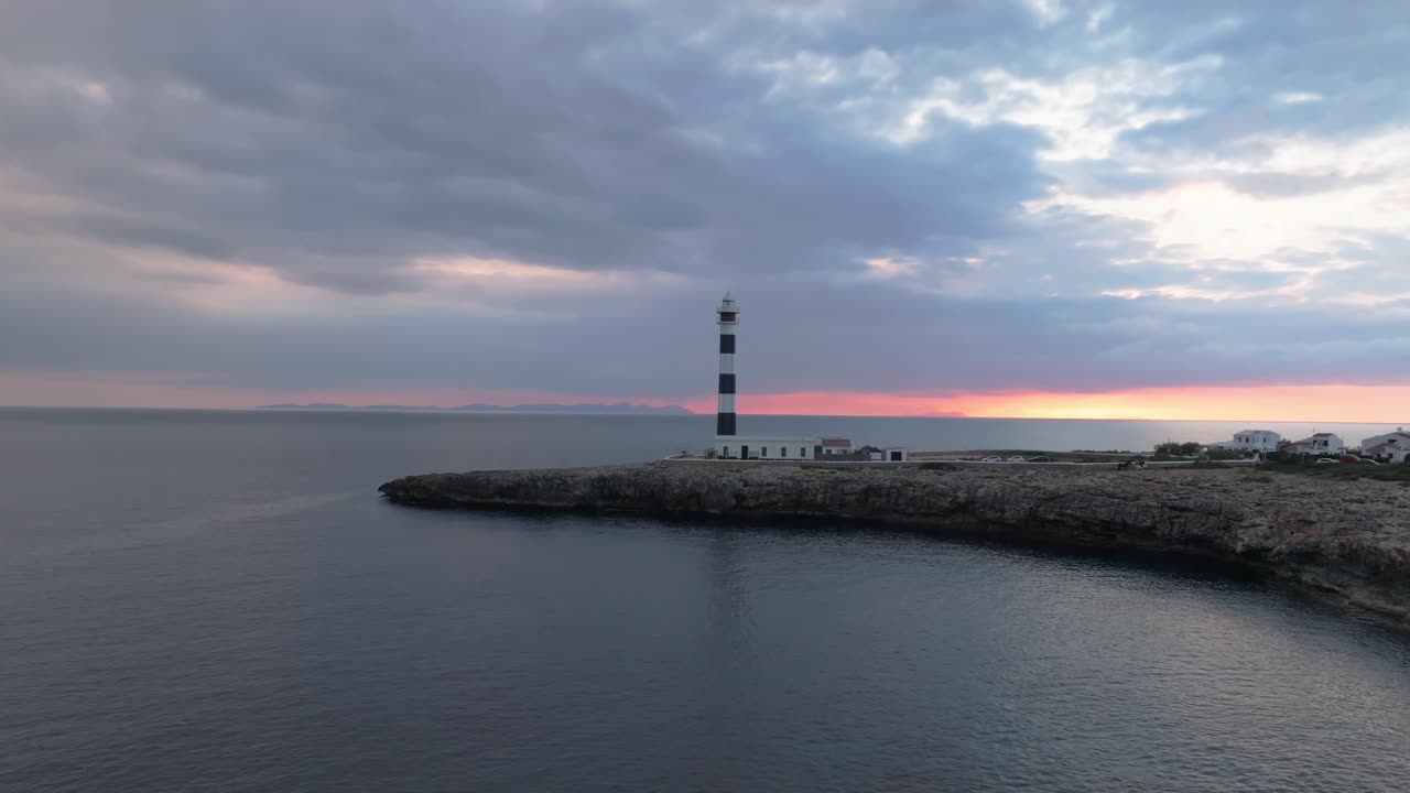 Panoramic Drone Shot of Cap d’Artrutx Lighthouse at Dusk, Menorca's coastline