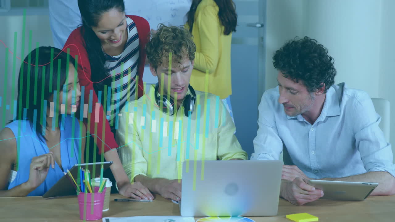 Collaborating in office, diverse team using laptops with animation data overlay