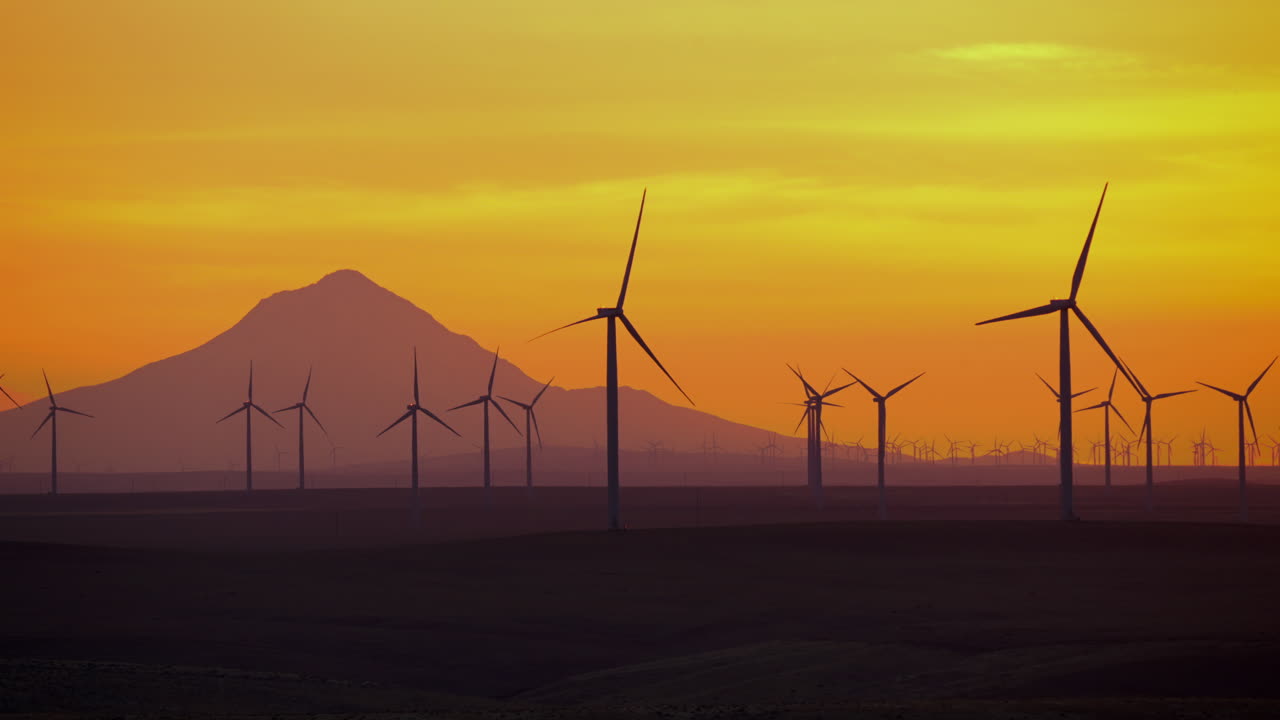 Dramatic View Of Mount Hood And Windmills Farm During Golden Hour In Eastern Oregon, USA. Slow Motion
